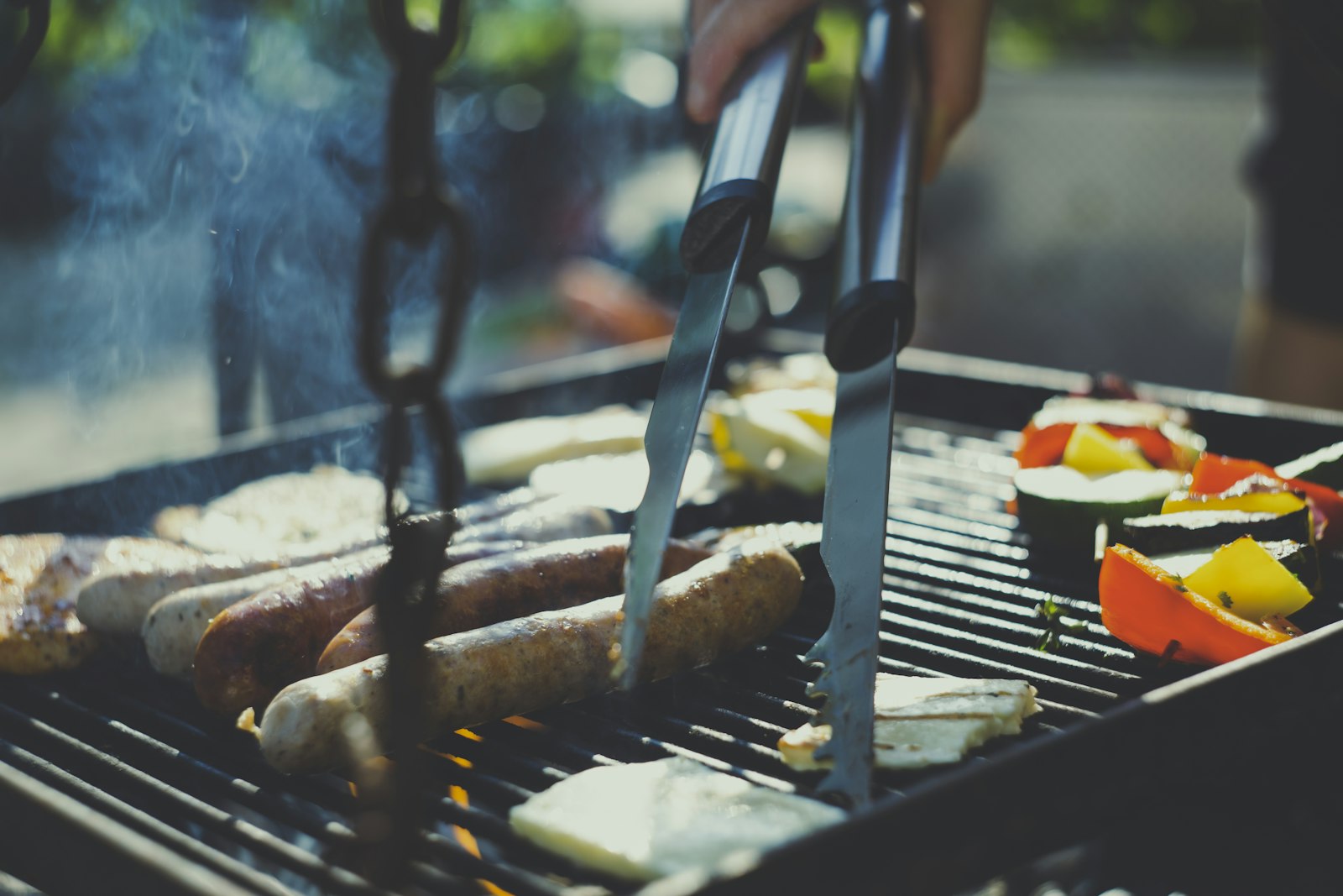 Vegetables and food grilling over an outdoor grill
