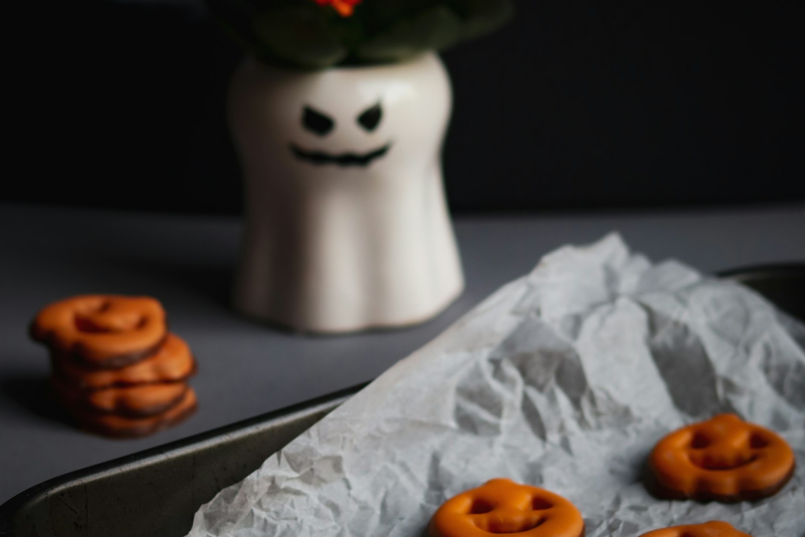 Halloween-themed baked treats on a rustic surface