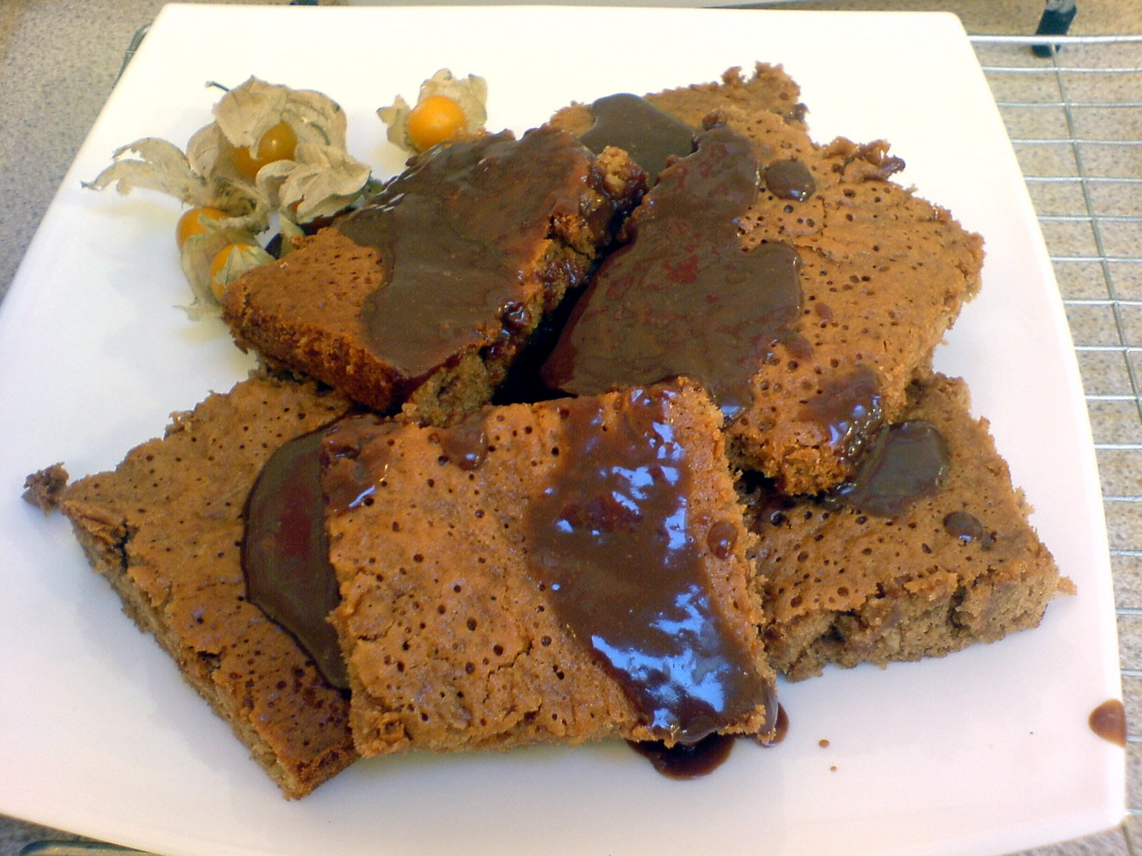 A pan of fudgy chocolate brownies cut into squares with one square lifted out